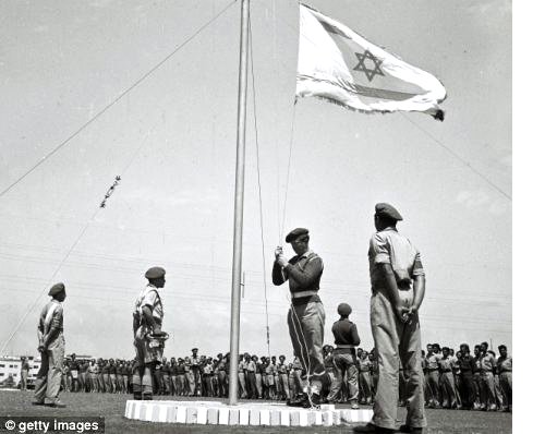 25-08-2019--left,-less-than-three----weeks-before-israels-independence,-the-flag-of-the-future-jewish-state--is---raised-at-morning-parade-at-a-training-base-on-april-27.jpg